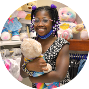 Build-A-Bear girl holding bear